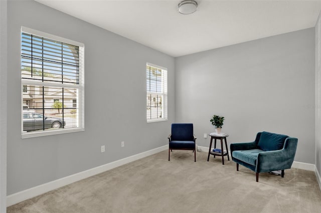 1061 Castlevecchio Loop, Orlando, FL 32825 - sitting room with healthy amount of natural light and carpet