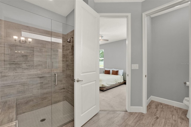 1061 Castlevecchio Loop, Orlando, FL 32825 - ensuite bathroom with a shower stall and wood finished floors