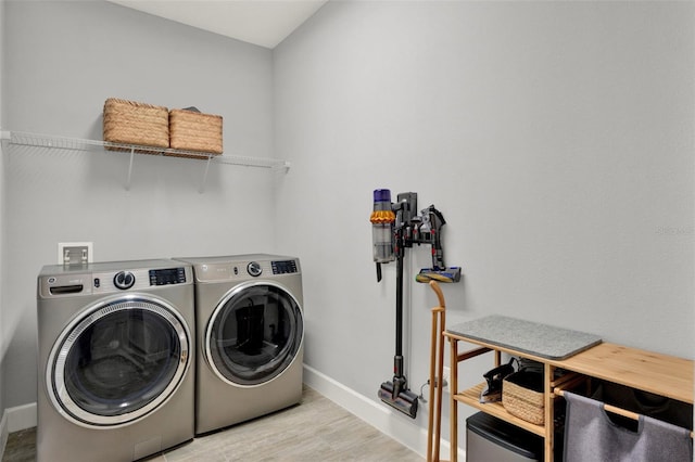 1061 Castlevecchio Loop, Orlando, FL 32825 - laundry room with washer and dryer and wood finished floors