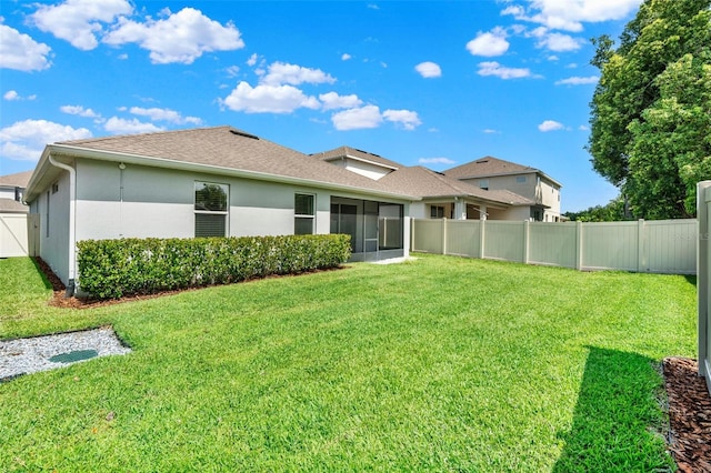 1061 Castlevecchio Loop, Orlando, FL 32825 - rear view of property featuring a shingled roof, a sunroom, and stucco siding