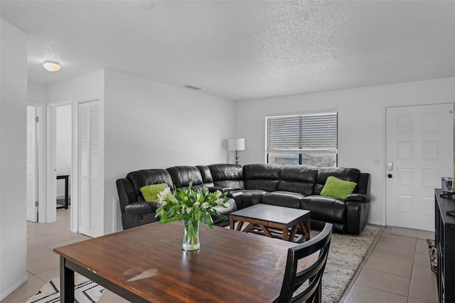 7344 Swallow Run Unit 7344, Winter Park, FL 32792 - living area featuring light tile patterned floors and a textured ceiling