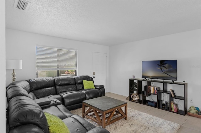 7344 Swallow Run Unit 7344, Winter Park, FL 32792 - tiled living area featuring a textured ceiling