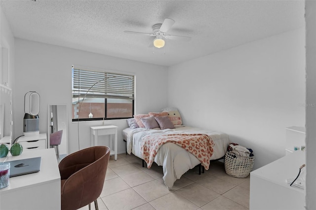 7344 Swallow Run Unit 7344, Winter Park, FL 32792 - bedroom featuring light tile patterned floors, a textured ceiling, and a ceiling fan