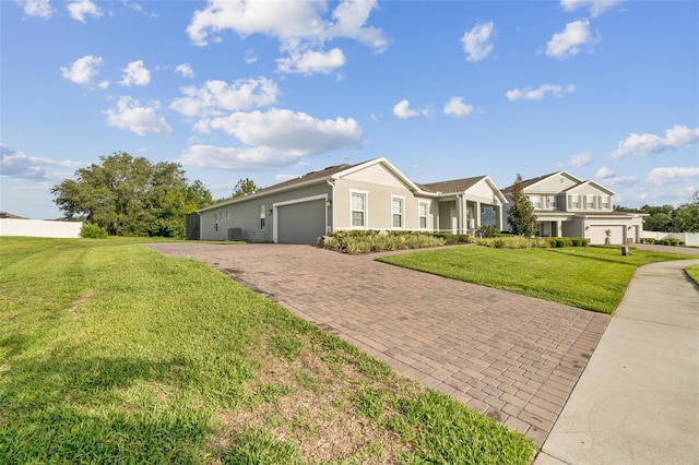 730 Rominger Loop, Apopka, FL 32712 - single story home featuring decorative driveway, a garage, a front yard, and stucco siding