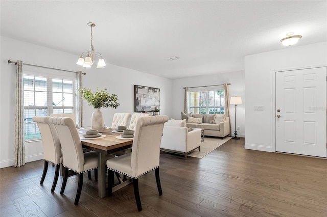 2432 Riviera Ln, Minneola, FL 34715 - dining space with dark wood finished floors and a chandelier
