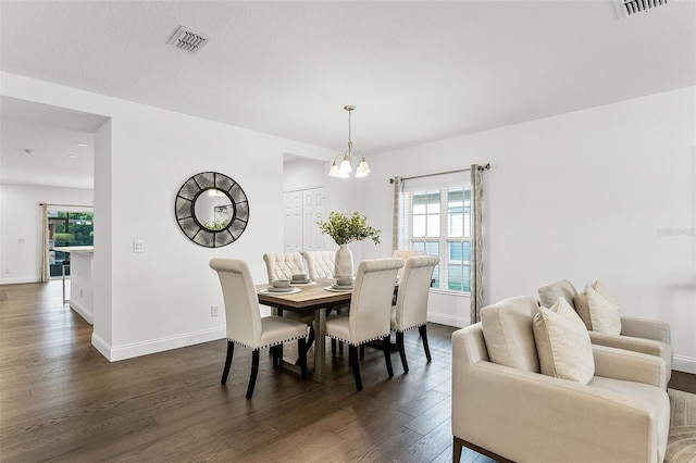 2432 Riviera Ln, Minneola, FL 34715 - dining room with dark wood-style flooring and a chandelier