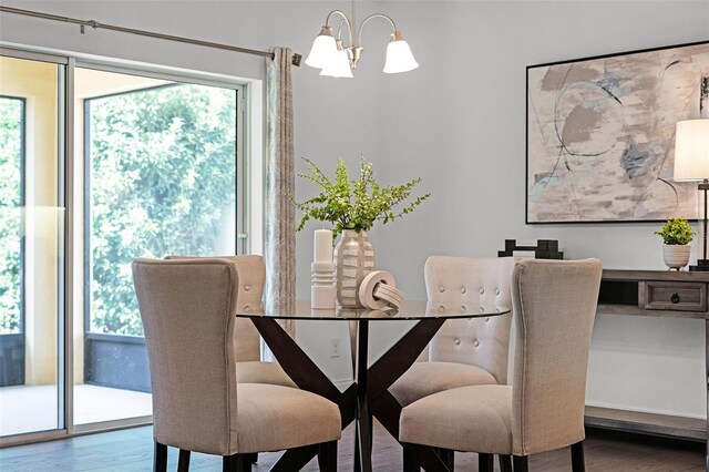 2432 Riviera Ln, Minneola, FL 34715 - dining room featuring wood finished floors and a chandelier