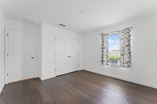 2432 Riviera Ln, Minneola, FL 34715 - unfurnished bedroom featuring dark wood finished floors and a closet