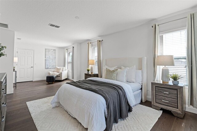 2432 Riviera Ln, Minneola, FL 34715 - bedroom with dark wood-style flooring and baseboards