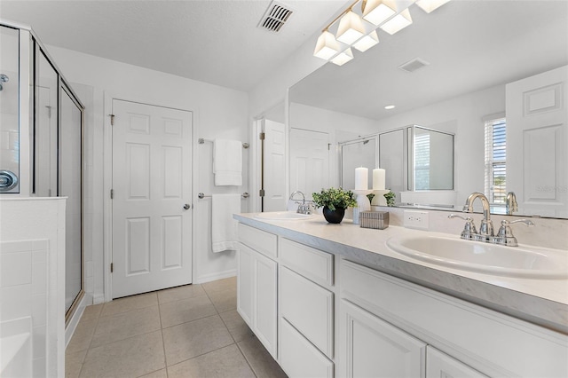 2432 Riviera Ln, Minneola, FL 34715 - full bath with a stall shower, double vanity, and tile patterned floors