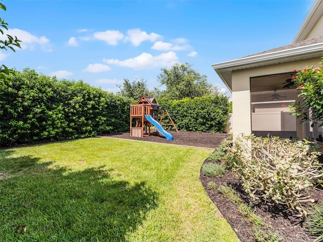 2432 Riviera Ln, Minneola, FL 34715 - view of grassy yard with a playground