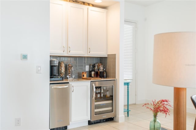 1545 Fairview Cir, Reunion, FL 34747 - indoor wet bar featuring wine cooler, decorative backsplash, and light tile patterned flooring
