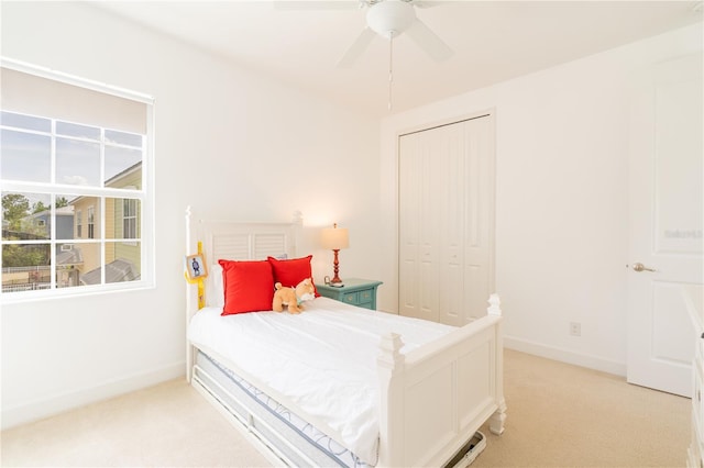 1545 Fairview Cir, Reunion, FL 34747 - bedroom featuring light colored carpet, a closet, and ceiling fan