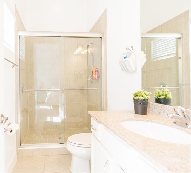 1545 Fairview Cir, Reunion, FL 34747 - bathroom with vanity, tile patterned flooring, and a shower stall