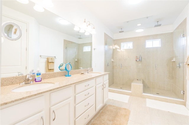 1545 Fairview Cir, Reunion, FL 34747 - bathroom with a stall shower, double vanity, plenty of natural light, and tile patterned floors