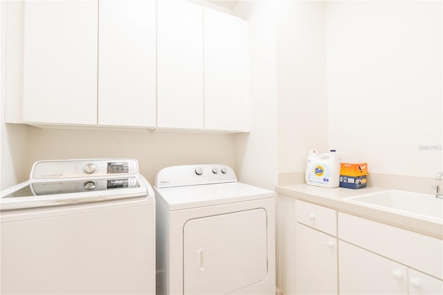 1545 Fairview Cir, Reunion, FL 34747 - laundry area featuring cabinet space and washing machine and dryer