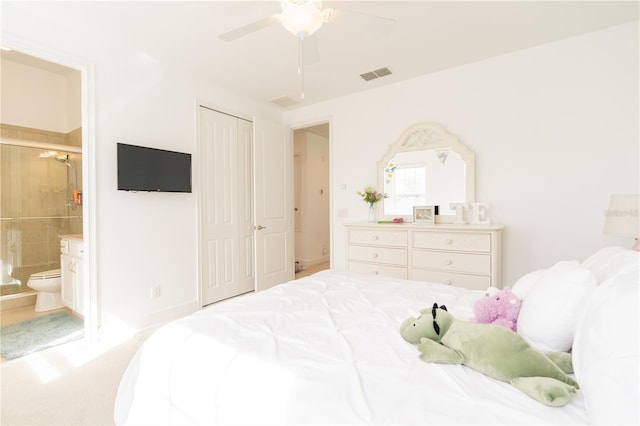 1545 Fairview Cir, Reunion, FL 34747 - bedroom with ensuite bath, a ceiling fan, light carpet, and a closet
