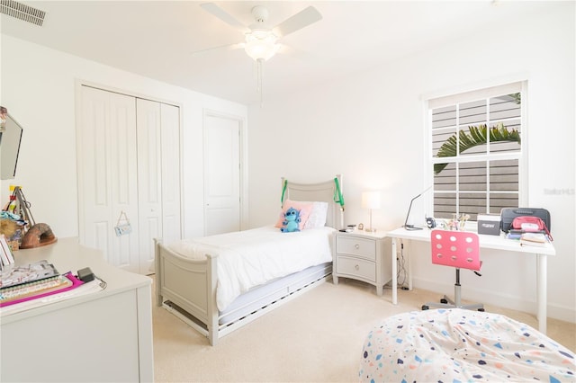 1545 Fairview Cir, Reunion, FL 34747 - bedroom featuring a closet, light carpet, a desk, and ceiling fan
