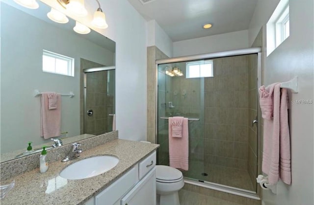 1545 Fairview Cir, Reunion, FL 34747 - full bathroom with vanity, plenty of natural light, and a stall shower