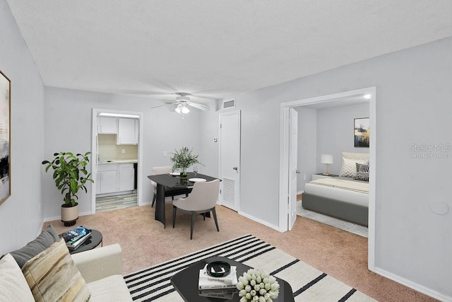 2517 Caper Ln Unit 207, Maitland, FL 32751 - living room with ceiling fan and light carpet