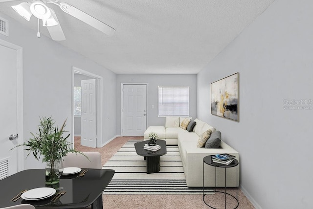 2517 Caper Ln Unit 207, Maitland, FL 32751 - living area with carpet, a ceiling fan, and a textured ceiling
