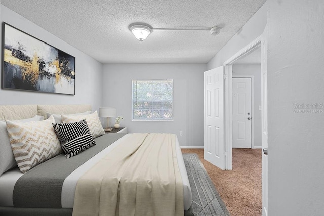 2517 Caper Ln Unit 207, Maitland, FL 32751 - carpeted bedroom featuring a textured ceiling and baseboards