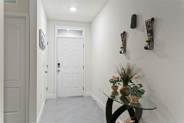 5808 Arboretum St, Saint Cloud, FL 34771 - doorway to outside with baseboards and light tile patterned floors