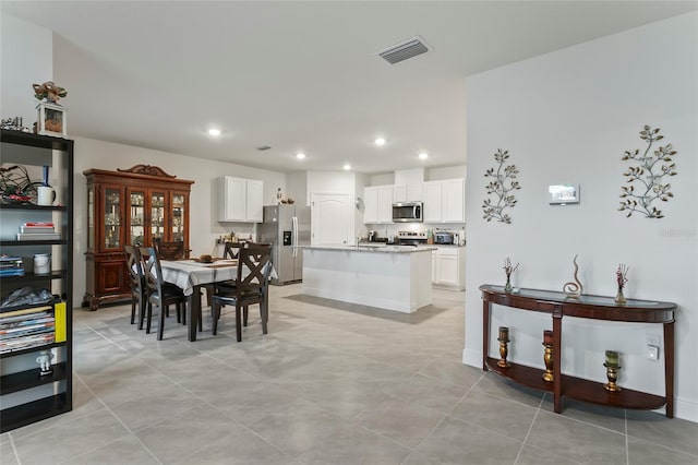 5808 Arboretum St, Saint Cloud, FL 34771 - dining area with recessed lighting and light tile patterned floors