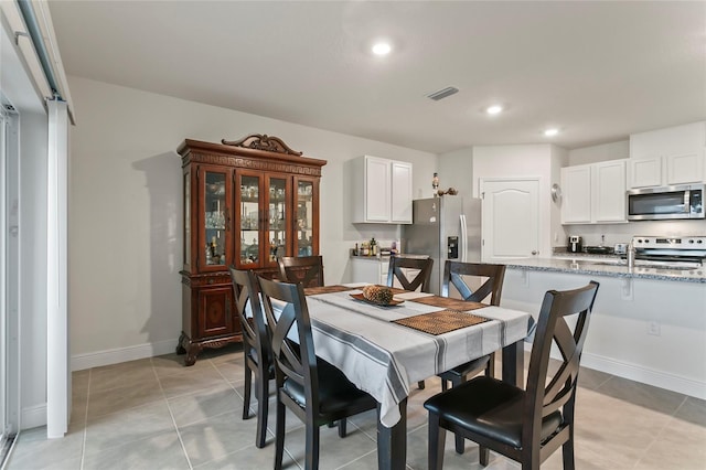 5808 Arboretum St, Saint Cloud, FL 34771 - dining space with recessed lighting and light tile patterned floors