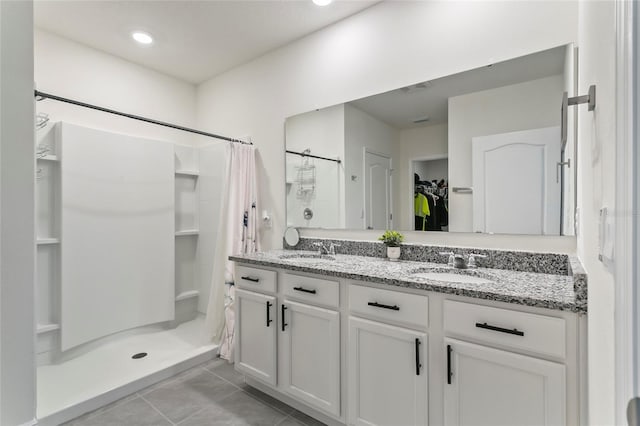 5808 Arboretum St, Saint Cloud, FL 34771 - full bath with a stall shower, tile patterned floors, double vanity, and a spacious closet