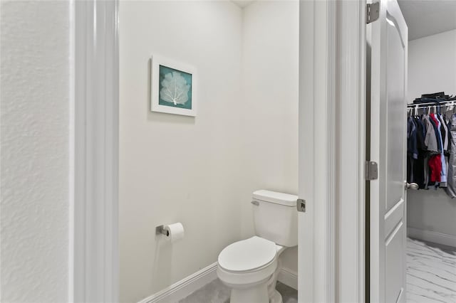 5808 Arboretum St, Saint Cloud, FL 34771 - bathroom featuring marble look tile flooring and a walk in closet