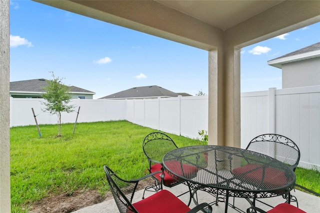 5808 Arboretum St, Saint Cloud, FL 34771 - fenced backyard featuring outdoor dining space and a patio
