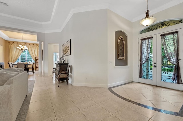 3316 Regal Crest Dr, Longwood, FL 32779 - foyer entrance with a chandelier, light tile patterned floors, french doors, and ornamental molding