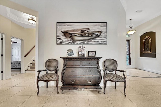 3316 Regal Crest Dr, Longwood, FL 32779 - living area featuring ornamental molding, light tile patterned floors, stairway, and arched walkways