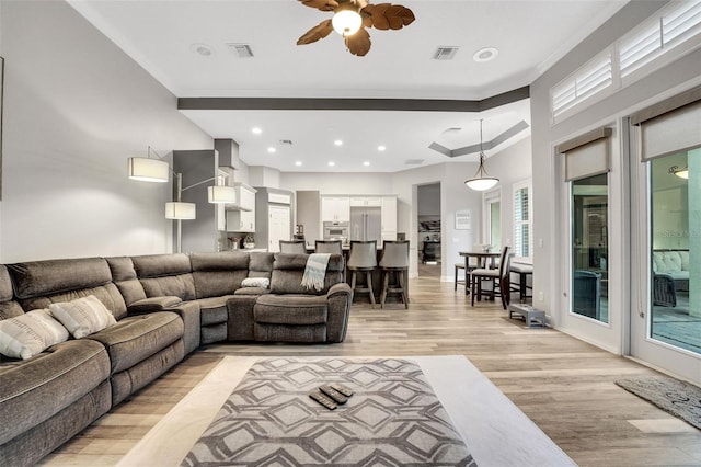 3316 Regal Crest Dr, Longwood, FL 32779 - living area with light wood finished floors, ceiling fan, and recessed lighting