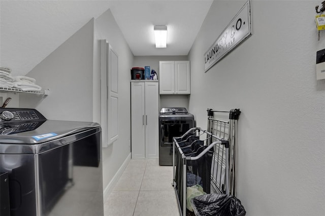 3316 Regal Crest Dr, Longwood, FL 32779 - laundry room with cabinet space, light tile patterned flooring, and separate washer and dryer