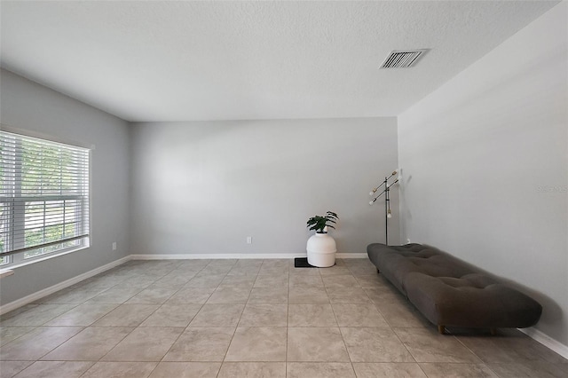 1292 Cavender Creek Rd, Minneola, FL 34715 - spare room featuring a textured ceiling and light tile patterned flooring
