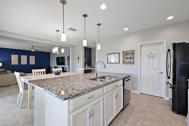 1292 Cavender Creek Rd, Minneola, FL 34715 - kitchen featuring freestanding refrigerator, open floor plan, dishwashing machine, a ceiling fan, and light tile patterned flooring