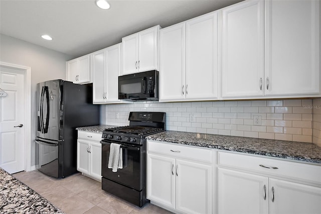 1292 Cavender Creek Rd, Minneola, FL 34715 - kitchen featuring black appliances, dark stone counters, white cabinets, and recessed lighting