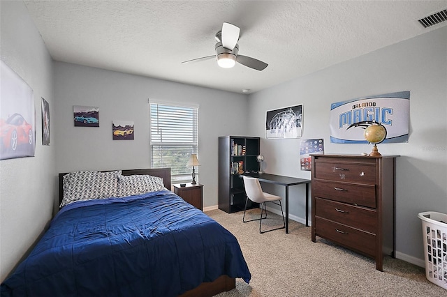 1292 Cavender Creek Rd, Minneola, FL 34715 - bedroom with light colored carpet, a textured ceiling, ceiling fan, and an office area