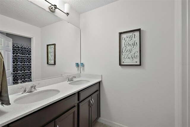 1292 Cavender Creek Rd, Minneola, FL 34715 - bathroom featuring double vanity and a textured ceiling