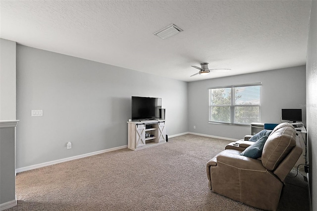 1292 Cavender Creek Rd, Minneola, FL 34715 - living room featuring light carpet, ceiling fan, and a textured ceiling