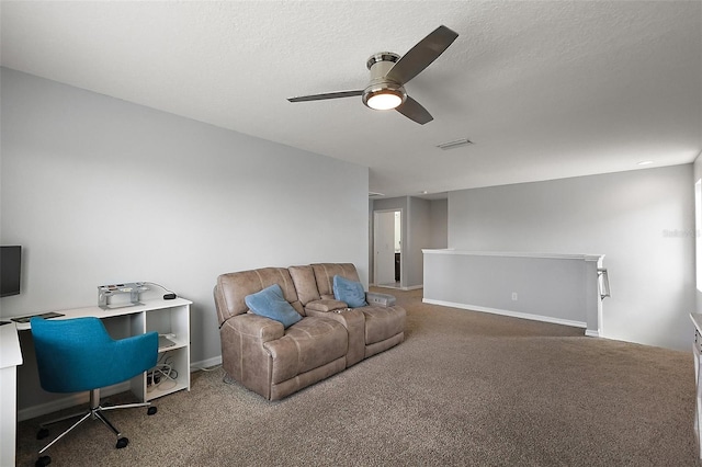 1292 Cavender Creek Rd, Minneola, FL 34715 - living room with carpet floors, ceiling fan, a desk, and a textured ceiling