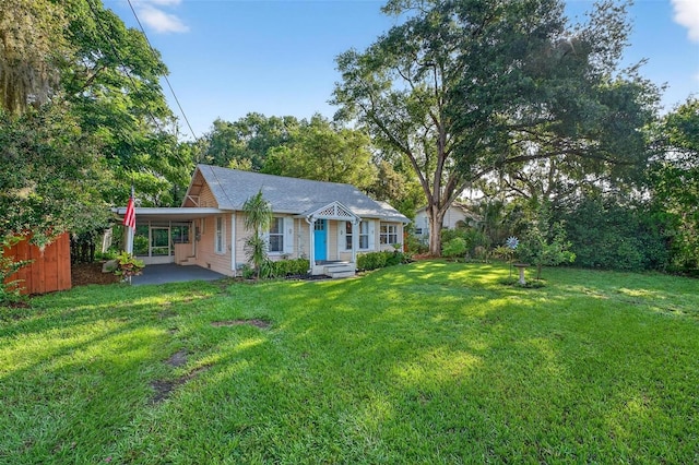 815 E 11th Ave, Mount Dora, FL 32757 - view of front of property featuring a front lawn and an attached carport