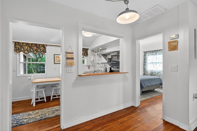815 E 11th Ave, Mount Dora, FL 32757 - corridor with wood-type flooring and healthy amount of natural light