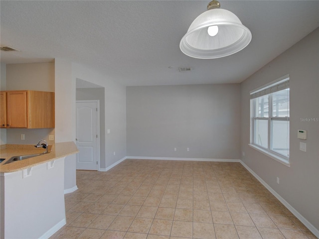 7462 Bentonshire Ave, Windermere, FL 34786 - unfurnished living room with a sink and light tile patterned floors