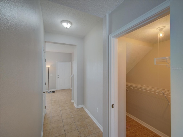 7462 Bentonshire Ave, Windermere, FL 34786 - hall with light tile patterned floors and a textured ceiling