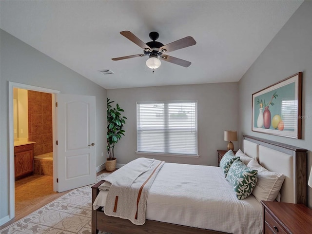 7462 Bentonshire Ave, Windermere, FL 34786 - bedroom with vaulted ceiling, ensuite bath, and a ceiling fan