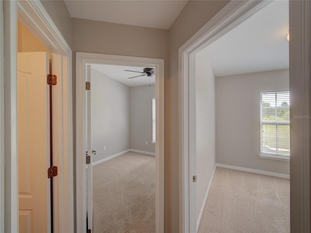7462 Bentonshire Ave, Windermere, FL 34786 - corridor featuring light colored carpet and baseboards