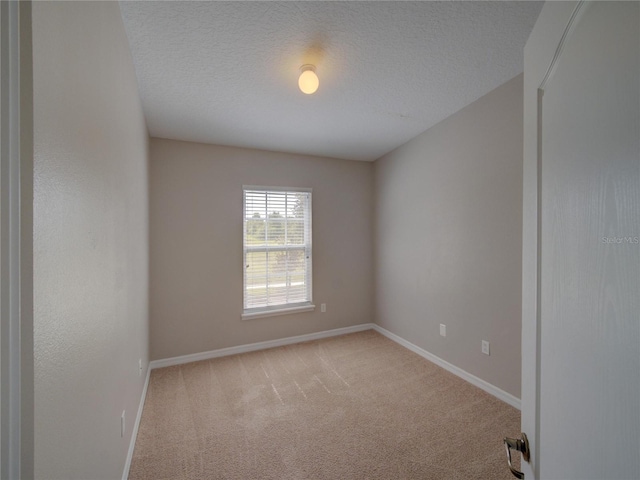 7462 Bentonshire Ave, Windermere, FL 34786 - carpeted empty room featuring baseboards and a textured ceiling